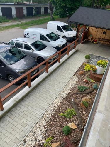 a group of cars parked in a parking lot at Penzion Pod pecí in Lenora