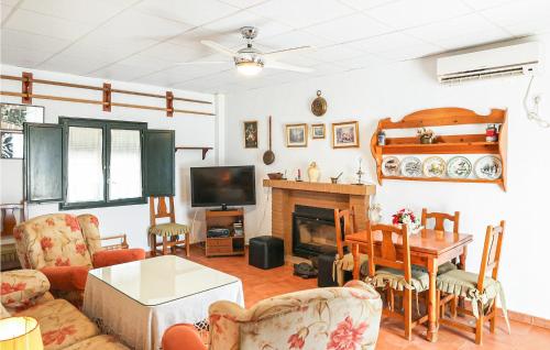 A seating area at Cozy Home In Utrera With Swimming Pool