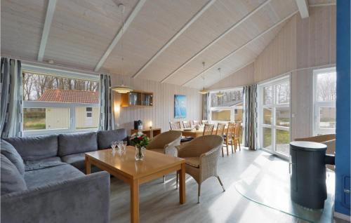 a living room with a couch and a table at Meeresrauschen 3 - Dorf 6 in Priwall