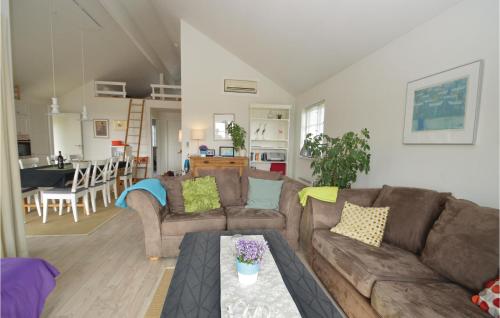 a living room with a couch and a table at Holiday Home Ternevangen Denmark X in Nysted