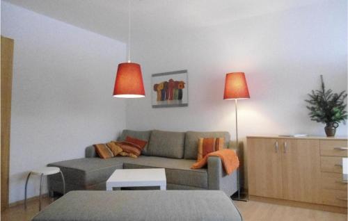 a living room with a couch and a table at Beautiful Apartment In Kühlungsborn in Kühlungsborn