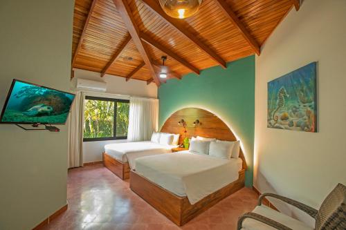 Кровать или кровати в номере Hotel El Velero
