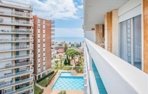 desde el balcón de un apartamento con piscina en Beach Front Apartment, en Sant Vicenç de Montalt
