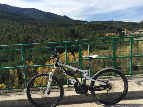 a bike parked on a bridge with a view at Masía La Safranera in Alcoy
