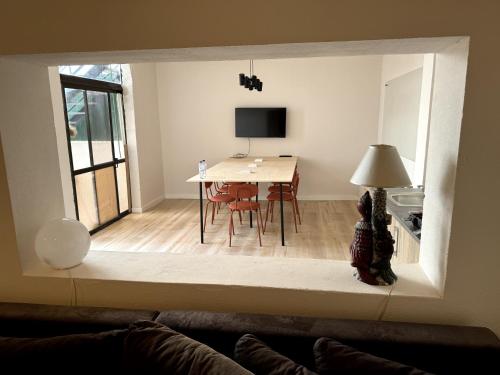 a living room with a table and a dining room at Retreat Villa, Full Amenities, up to 40ppl in Lisbon