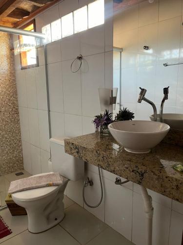 a bathroom with a sink and a toilet at Pouso Bem Estar in Tiradentes