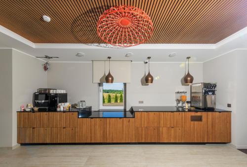 a kitchen with a counter and a window at Reiu Holiday Centre in Paikuse