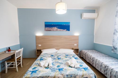 Posteľ alebo postele v izbe v ubytovaní B&B Profumi di Sicilia