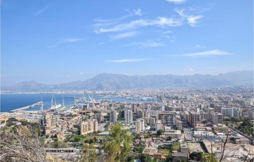 a view of a city with the ocean and mountains at Mages in Casteldaccia