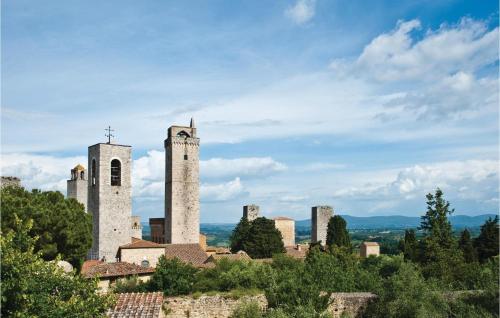an old castle with two towers on a hill at Piazzale 2 in Castellina in Chianti