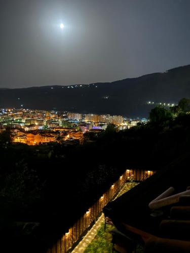 a view of a city lit up at night at Guest House Mario in Berat