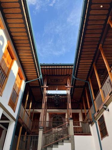 an outside view of a building with a wooden roof at Hotel San Miguel de Salento in Salento