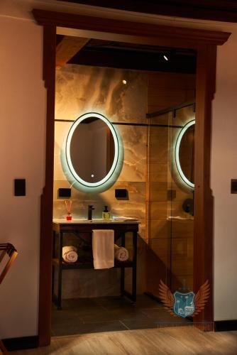 a bathroom with a sink and a mirror at Hotel San Miguel de Salento in Salento