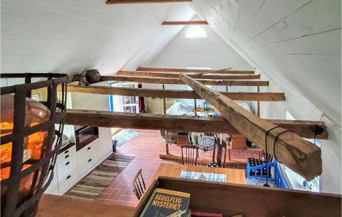 an attic room with a bunch of wooden stairs at 2 Bedroom Cozy Home In Munka Ljungby in Munka-Ljungby