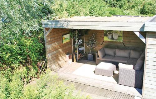 a shed with a couch and chairs in it at Beautiful Home In Wolphaartsdijk in Wolphaartsdijk