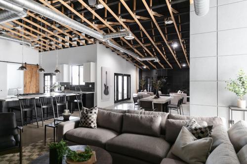 a living room with a couch and a bar at Modern Industrial-Near Old Town in Scottsdale