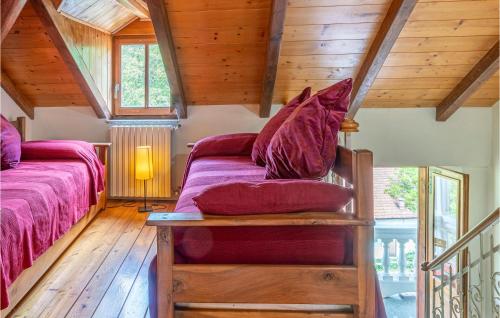 a attic bedroom with a bed and a couch at Pet Friendly Apartment in Carchelli
