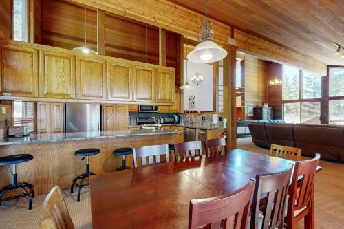 a large kitchen with a wooden table and chairs at Amazing Dollar Point Retreat in Tahoe City