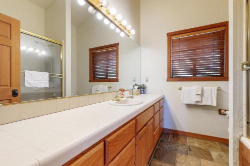 a bathroom with a sink and a large mirror at Amazing Dollar Point Retreat in Tahoe City