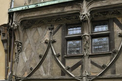 a large wooden door with windows on a building at La Dame Blanche - Appartement hypercentre historique - Parking privé in Bourges