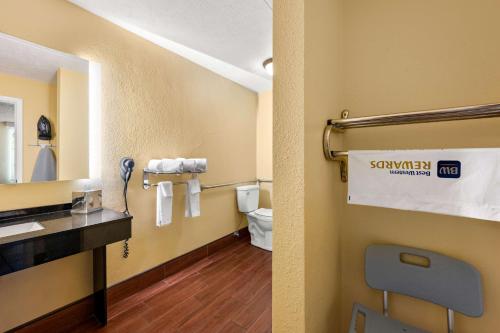 a bathroom with a sink and a toilet in a room at Best Western Corbin Inn in Corbin