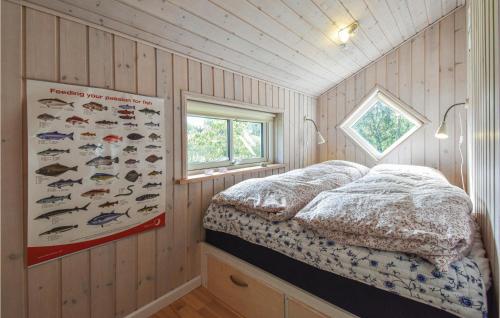 a bedroom with wooden panel walls and a bed in a room at 3 Bedroom Cozy Home In Martofte in Martofte