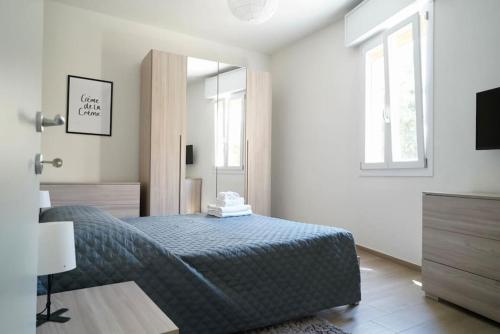 Postel nebo postele na pokoji v ubytování Molinari House Modena Smeraldo