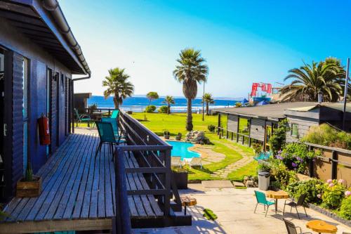 a balcony of a house with a view of the ocean at Hotel Trocadero in Concón