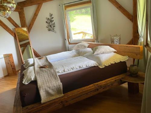 Кровать или кровати в номере Ferienhaus Auszeit in Wolfsberg