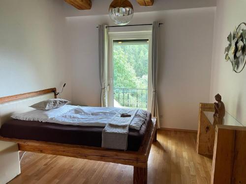 Кровать или кровати в номере Ferienhaus Auszeit in Wolfsberg