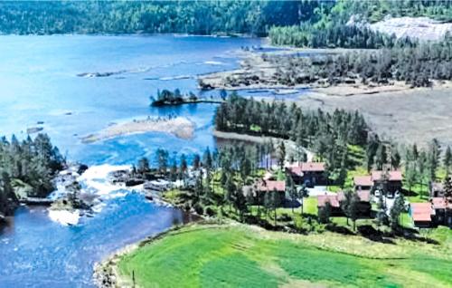 an aerial view of a river with houses and trees at Bjørnehiet - Hytte 6 in Øvre Ramse