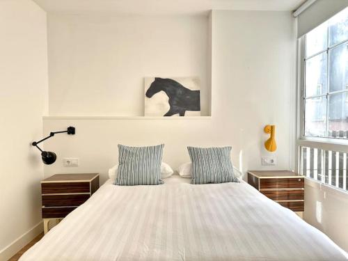 En eller flere senge i et værelse på Alojamiento acogedor