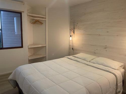 Postel nebo postele na pokoji v ubytování Hostal CKAIR