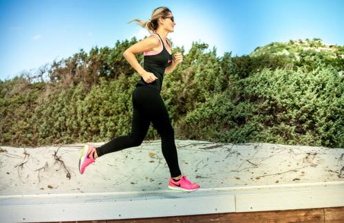 a young woman running on a ledge at Hotel Fiore Di Maggio in Villasimius