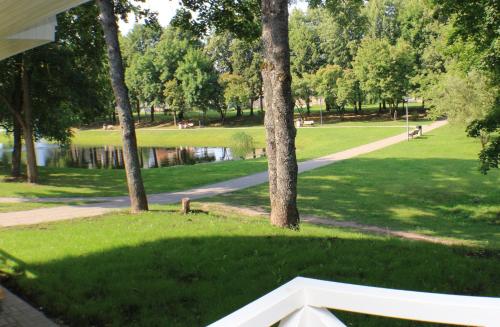 a view of a park with trees and a path at Vila Klasika in Birštonas