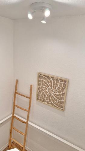 a room with a ladder and a picture on the wall at Villas at Seven Dwarfs Resort - Near to Disney in Kissimmee