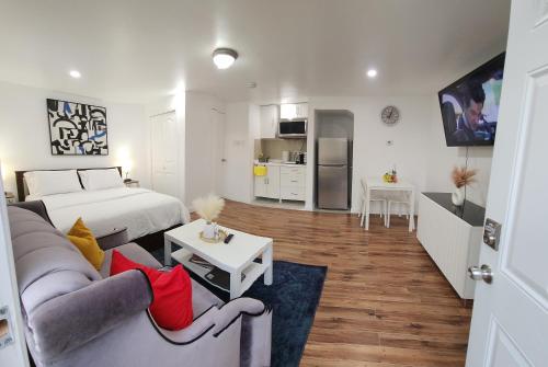 a living room with a couch and a bed in a room at Room in Halifax - Studio Suite in Halifax