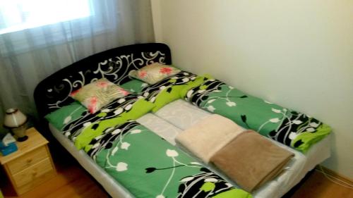 Кровать или кровати в номере Pine Wood Apartment