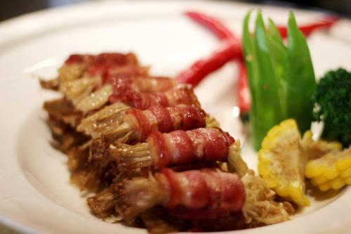 a plate of food with meat and vegetables on it at Crowne Plaza Huangshan Yucheng by IHG in Huangshan