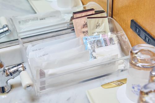 a bathroom counter with a sink and a mirror at Hotel Kumamoto Terrsa in Kumamoto