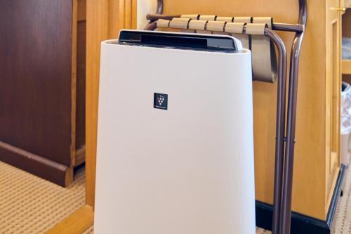 a white refrigerator with a rack on top of it at Hotel Kumamoto Terrsa in Kumamoto