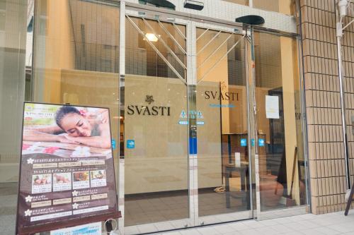 a sign in the window of a store at Hotel Kumamoto Terrsa in Kumamoto