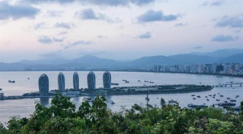 a view of a city with a river and buildings at Sanya Baohong Hotel in Sanya