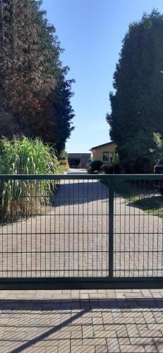 a black fence in front of a driveway at Appartement in Buchenhain mit Großem Garten in Buchenhain