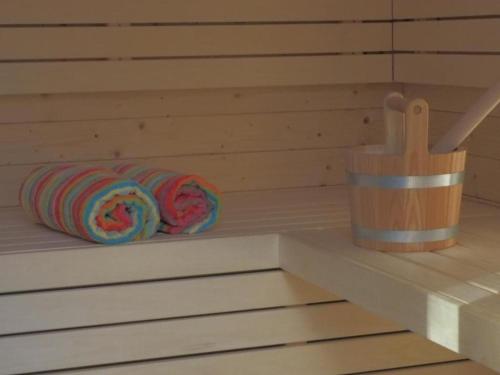 a coil of yarn sitting on a shelf in a sauna at Exklusives Ferienhaus in Huppenbroich mit Terrasse, Grill und Garten in Simmerath
