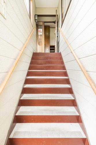a staircase leading up to a building at Popotel 2 NIKAI in Matsumoto