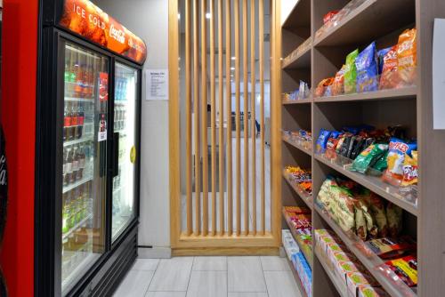 a store aisle with a grocery store with food at Holiday Inn Express & Suites - Wylie West by IHG in Wylie
