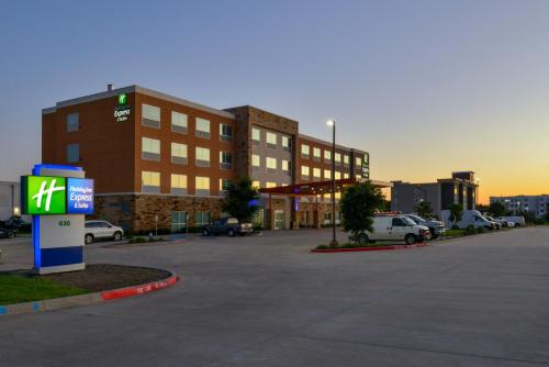 a parking lot in front of a large building at Holiday Inn Express & Suites - Wylie West by IHG in Wylie