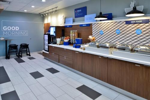 a fast food restaurant with a good morning sign on the wall at Holiday Inn Express & Suites - Wylie West by IHG in Wylie