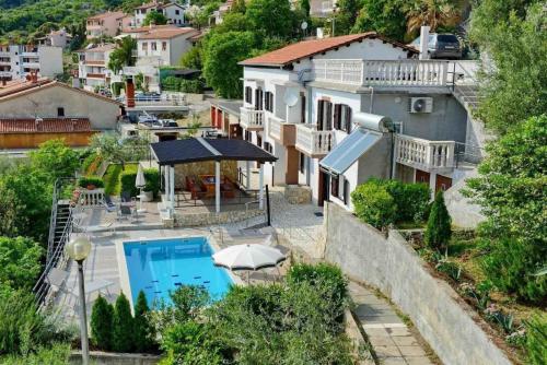 a view of a house with a swimming pool at Ferienhaus 'Villa Ivisa' mit eigenem Pool in Rabac